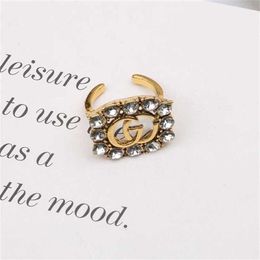 10% de descuento 2023 joyería familia letras simples hombres y mujeres moda universal anillo delicado temperamento abierto joyería de mano de diamantes de imitación