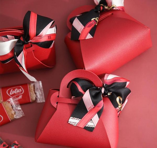 10 PCS Boîte-cadeau en cuir Creative Handbag Shape Ribbon Bow Temperament Small Boîtes pour cadeaux Box Candy Box Emballage CX22045772613