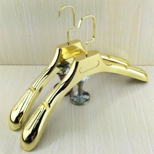 10 Unids / lote Alto Grado Hermoso Brillante Dorado Hombro Ancho Lujo Oro Plástico Percha Perchero para Abrigos Pantalones Vestido de Novia T205O