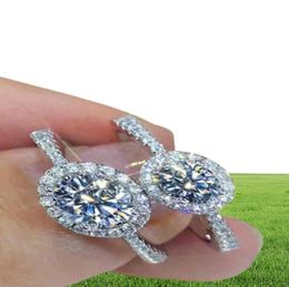 Обручальные женские обручальные кольца с муассанитом 100 GRA из настоящего стерлингового серебра 2 карата с круглым бриллиантом и ореолом, ювелирные украшения15834485028386
