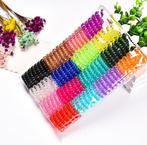100 stks loten 3,5 cm Kleurrijke heldere coffee touw gom rubberen ring spiraal elastische banden haaraccessoires voor vrouwen