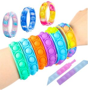 Paquete de 100 pulseras Fidget Toys Pack para niños favor Mini Simple Dimple Digit Push Bubble Silicona Muñequera Niño y niña Juguete de descompresión sensorial DHL