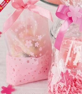 100 stuks 16x26cm roze kersenbloesem afdrukken transparante geschenkverpakkingen plastic zak voor snoep en snoep kerst wrap3711622