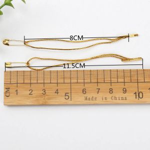 100pcs 8 cm de longueur Gold Lignes boucle verrouille les tags de vêtements de haute qualité étiquettes de cintre de broches de tension accessoires en gros