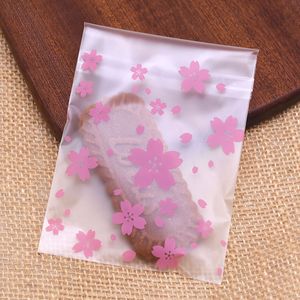 100pcs Cherry Blossoms Cookie Cookie Sacs en plastique auto-adhésifs pour le sac cadeau de fête de Noël Bagure d'emballage de boulangerie Sac d'emballage