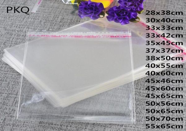 100 piezas transparentes bolsas de celofán auto selladoras Repeinables Opp Bag de Plastic Opp para un regalo de juguete Bolsa de plástico grande.