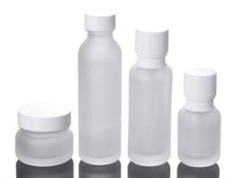 Botellas de embalaje Frasco de vidrio esmerilado Loción Crema Botellas Frascos cosméticos redondos Botella de bomba de cara de mano con tapa de grano de madera SN4022 Entrega de gota 2021 Paquete