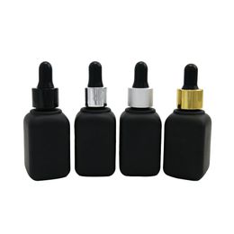 100 stks / partij 30 ml vierkant mat zwart glas cosmetische essentiële olie e vloeibare druppelaar fles 1oz reizen navulbare container