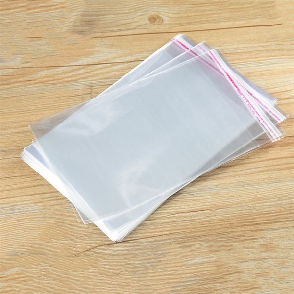 100pcs / lot sacs en cellophane transparents sacs d'étanchéité auto-adhésifs plats pochettes cadeaux en plastique OPP pour bonbons biscuits vêtements bijoux