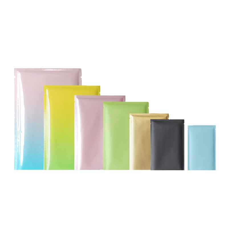 100 unids / lote Bolsa de papel de aluminio de colores Bolsa de plástico abierta superior Bolsa plana Bolsas de embalaje de almacenamiento a prueba de olores para alimentos Cosméticos
