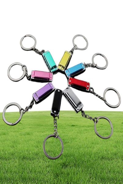 100pcs / lot metal 4 trous mini harmonica keychain jouet keyring's dons clés sacs clés clés mobiles clés anneaux 7266711