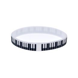 100pcs Bracelet en caoutchouc en silicone clé Piano Super à utiliser dans tout cadeau d'avantages pour les fans de musique 264x