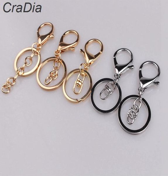 100pcs Set 30mm 12Designs Chaînes clés Anneaux clés Round Golden Silver Color Lobster Clasp Keychain T2008049084751