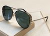 gold frame green mirror lens