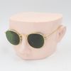 Gold frame green lens