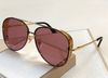 gold frame red lens