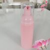 Botella rosa + tapa transparente de la bomba rosa +