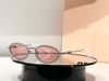 Silver frame with diamond pink lenses