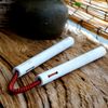 white knotted wooden nunchakus