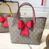 pink handle+red bowknot