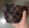 Brown belts with black buckle