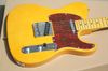 guitar with red pickguard
