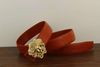 gold buckle red