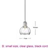 small, clear glass, black cord