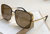 gold frame brown lens