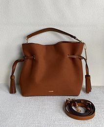 10A sac de créateur nouveaux produits d'automne et d'hiver coooh cm091 andy24 Sac porte-bonheur, sac à pompon en daim, sac de créateur, portefeuille, sac de voyage rétro pour femme, sac de grande capacité marron