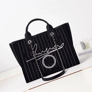 10A sac fourre-tout de luxe marque de mode sac fourre-tout pour femmes rayé grande capacité toile un sac à bandoulière Portable sac de plage