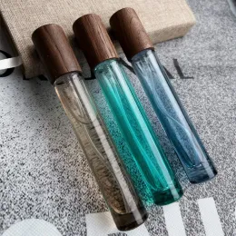 Botellas de Perfume de vidrio de 10ml, botellas de Spray de prensa de Color azul, verde y marrón, botellas rellenables vacías de aceite esencial de fragancia