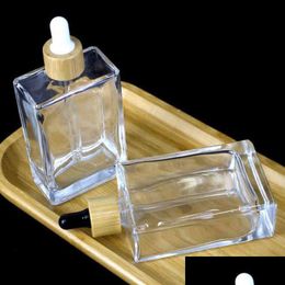 10 pièces 100 ml flacon compte-gouttes en verre carré plat transparent avec bouchon en bambou doré rose or noir Y220428 livraison directe Dhxdh