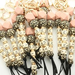 10PC nouveau cadeau de fête des mères concepteur motif léopard perles de bois de Silicone maman porte-clés emblème porte-clés 240125