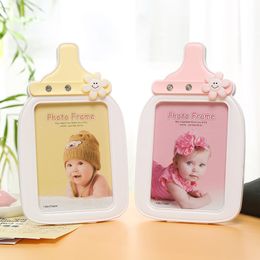 10 stks schattige baby doop feest decoratie benodigdheden 7 inch creatieve babyfles fotolijst boetiek cartoon foto frames verjaardag souvenirs