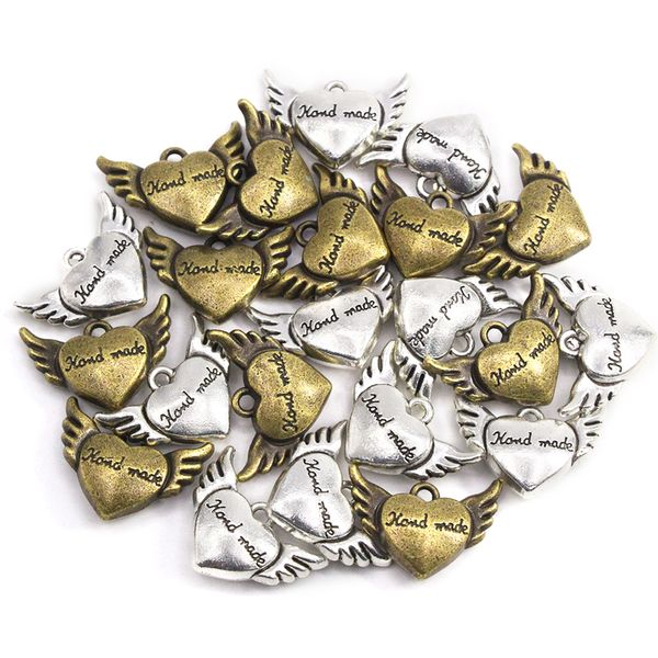 10 piezas de alas de corazón Etiquetas hechas a mano etiquetas de metal de bronce de bronce etiqueta de aleación hecha a mano para sombreros de ropa bolsas de costura 20*15 mm