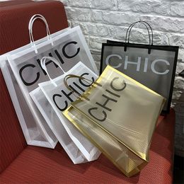 10pcs épais grands sacs en plastique 26x23cm noir et blanc lettre grille shopping bijoux emballage sacs sac cadeau en plastique avec poignée 220420