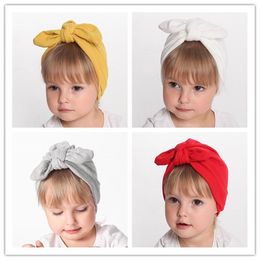 12 colores Sombrero cálido de invierno para niños Diadema lindo bebé orejas de conejo anudado gorro de terciopelo de lana gruesa DHL 20