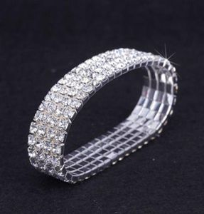 12 pièces Lot 4 Row Crystal Diamante Rhinestone Elastic Bridal Bracelet Stretch Stretch Accessoires de mariage entiers pour les femmes3824853