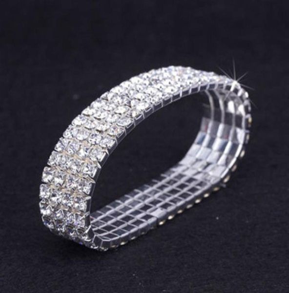 12 pièces Lot 4 Row Crystal Diamante Rhinestone Elastic Bridal Bracelet Stretch Stretch Accessoires de mariage entiers pour les femmes1966240
