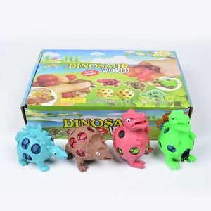 12 unids / lote TPR Creativo Novedad Juguetes Dinosaur Vent Ball Squeeze Stress Relief Ball Grid Uva Mano Fidget Dinosaurios Rising Descompresión Juguete Adultos Niños Regalo 2680