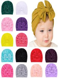 15 couleurs Date Bébé chapeaux casquettes avec noeud décor enfants filles accessoires de cheveux Turban Noeud Head Wraps Enfants Enfants Hiver Printemps Bea3060737