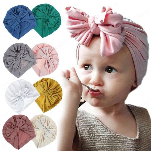 18 colores bebé niñas otoño invierno cálido tejer sombreros niños mejor venta lindo arco algodón sólido sombrero niños accesorios para el cabello