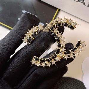 18k vergulde broches Luxe merkontwerpers Zwart-wit kruis Kristal Diamant Parelprint Mode Dames Paar Liefde Broches Bruiloft Sieraden Cadeau