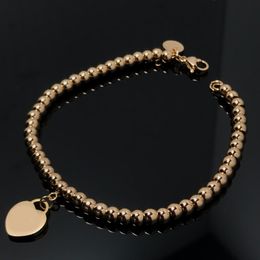 18K vast goud perzik hartvormige meisjes armband licht luxe niche -ontwerper liefde hartvormige kralenarmband