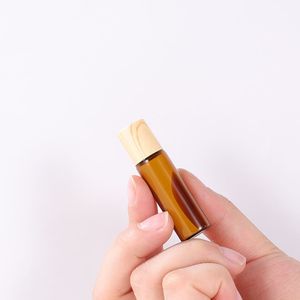 Bouteille à rouleau ambre de 1 ml 2 ml 3 ml 5 ml avec roulement à billes transparent et capuchon en grain de bois