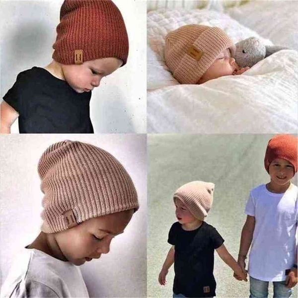 2-7 años NIÑOS Beanie Hat Niños Niñas Slouch Winter Woolly Ski Childrens Turn Up Neon Warm Leather Label tejido Bebé Gorros de lana Sólido