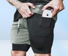 2 in1 Running Mens Gym Sports Shorts intégrés Téléphone Pocket Douner Pantalon Pantalon Gym Training Body Body Body