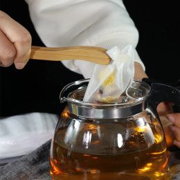 20/50 / 100pcs Sacbags à thé jetables Sacs de filtre à thé en tissu non tissé pour le thé à l'épices avec du papier filtre à cordes de tirage pour le thé en vrac aux herbes