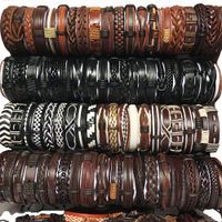 100pcs / lot atacado couro pulseiras artesanais de couro genuíno pulseiras moda manguito pulseira para mulheres dos homens cores jóias combinação de novo